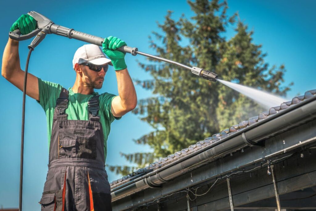 Technician cleaning roof